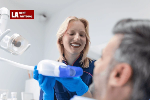 Dentist performing lazer whitening on a patient to remove extrinsic stains Wolverhampton